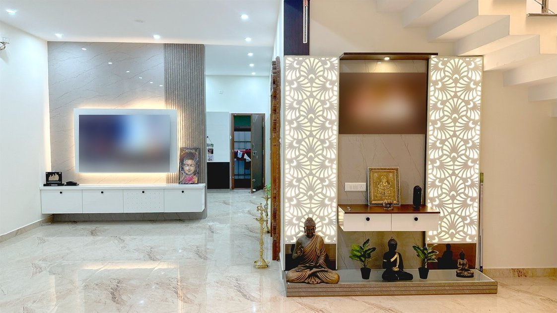 Completed living room with lit jali pooja unit and floating TV unit